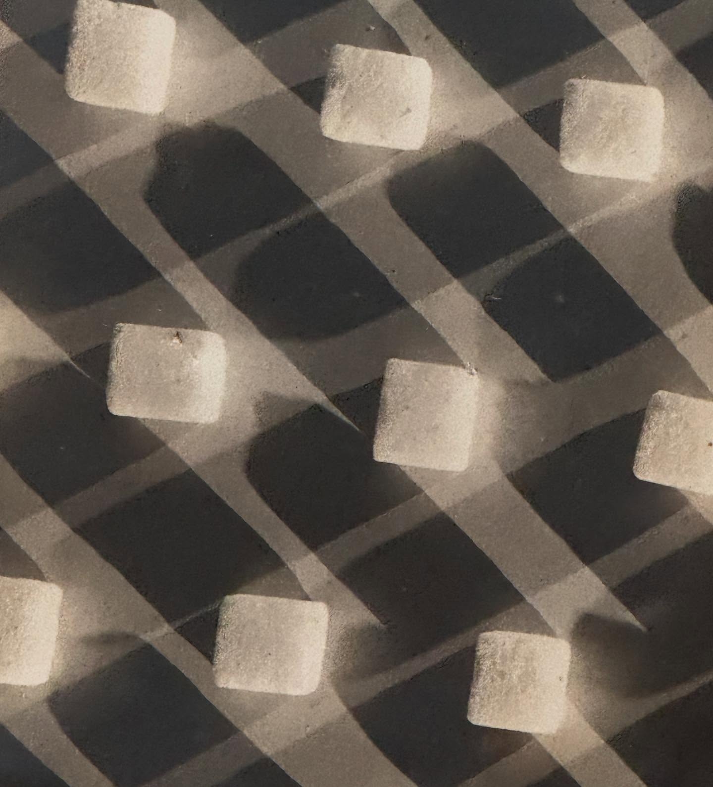 Industrial Precision: Close-Up of a Metal Grate
